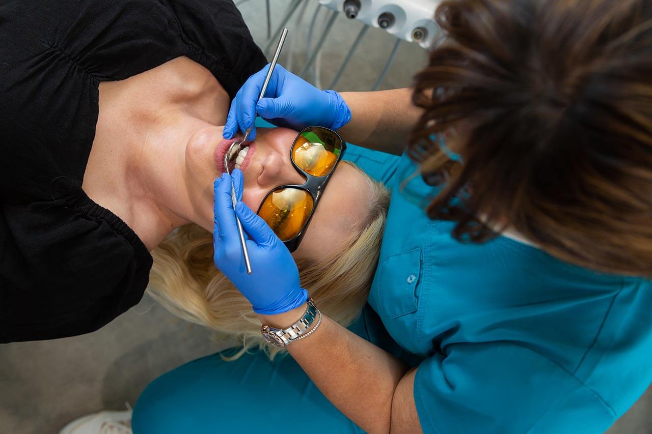 Persheng making a dental inspection