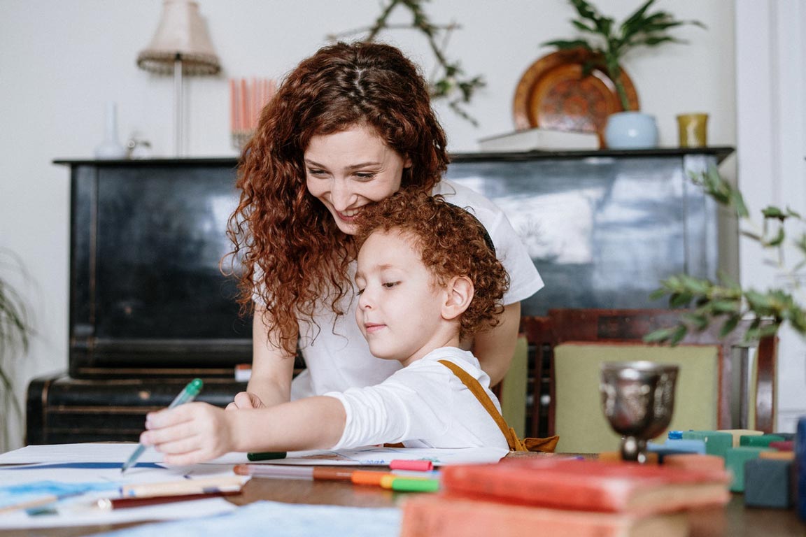 Mum painting with her child