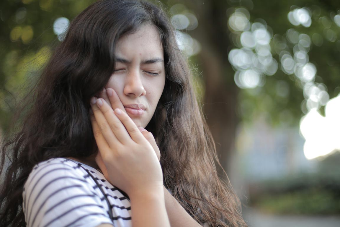 Toothache Girl with bad toothache