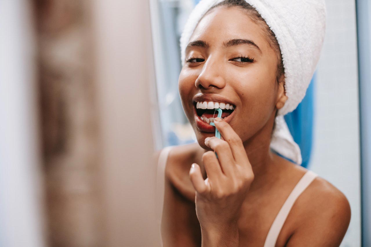 Woman flossing Woman flossing
